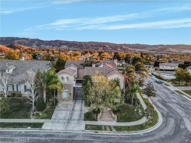 birds eye view of property with a mountain view