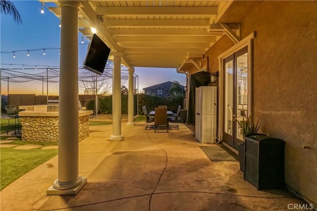 view of patio / terrace with fence, outdoor dry bar, and outdoor dining area