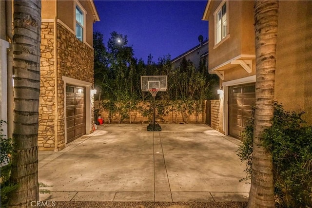 patio at twilight with a garage