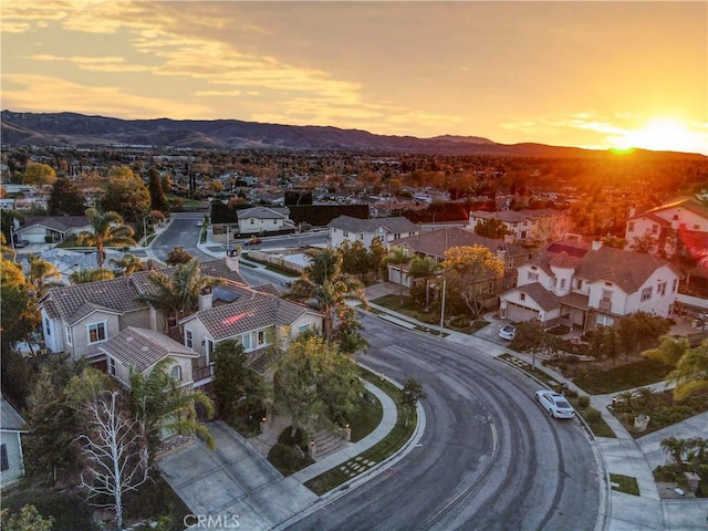 aerial view at dusk with a mountain view