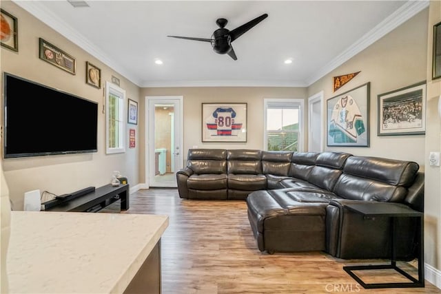 living room featuring recessed lighting, ornamental molding, a ceiling fan, and light wood finished floors
