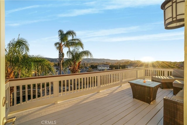 wooden deck featuring a mountain view