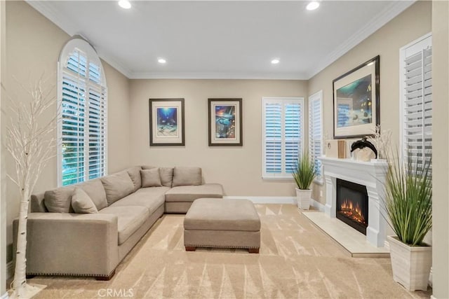 carpeted living room featuring recessed lighting, crown molding, a warm lit fireplace, and baseboards