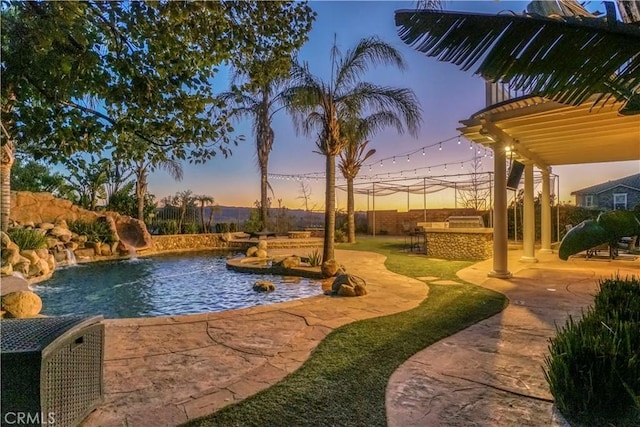 view of property's community with a pool and a patio