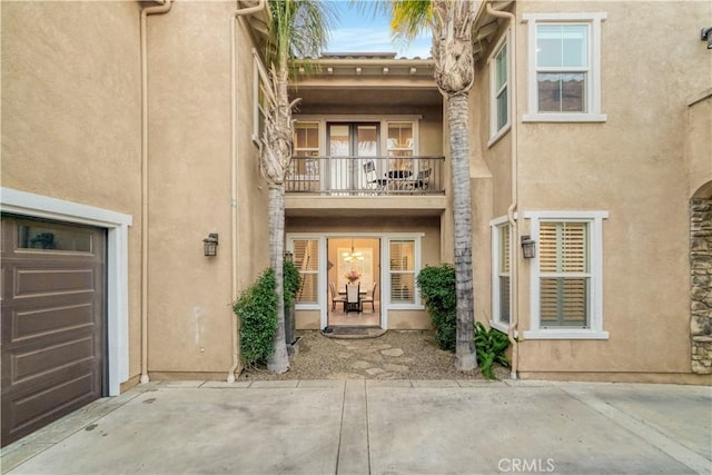 back of property with a balcony