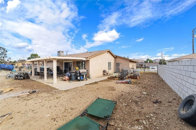 rear view of property featuring a patio