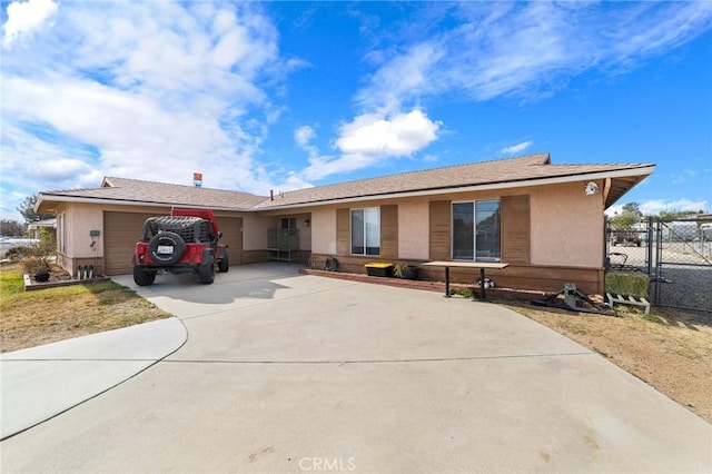 ranch-style house featuring a garage