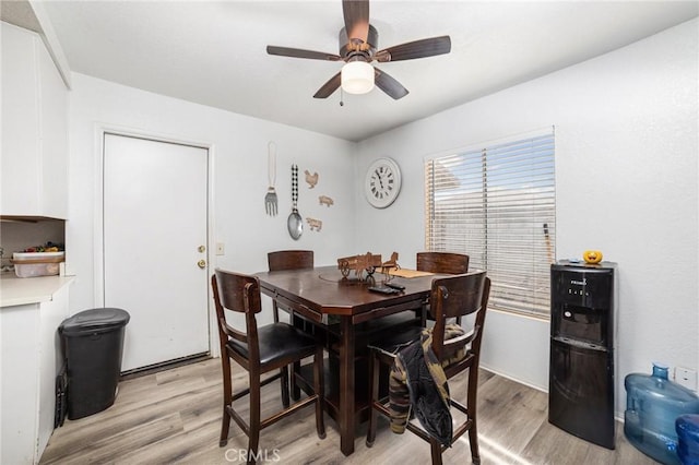 dining area featuring ceiling fan and light hardwood / wood-style flooring