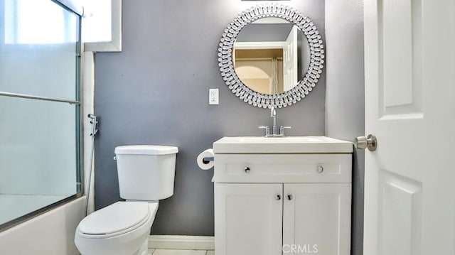 full bathroom featuring shower / bath combination with glass door, vanity, and toilet