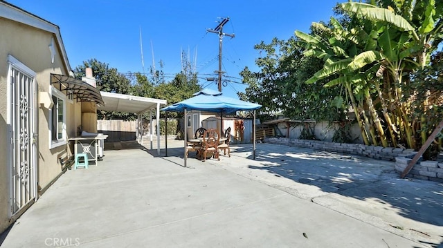 view of patio / terrace with a storage shed