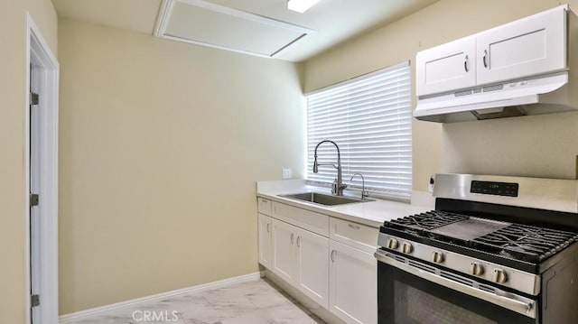 kitchen with white cabinets, stainless steel gas range oven, and sink