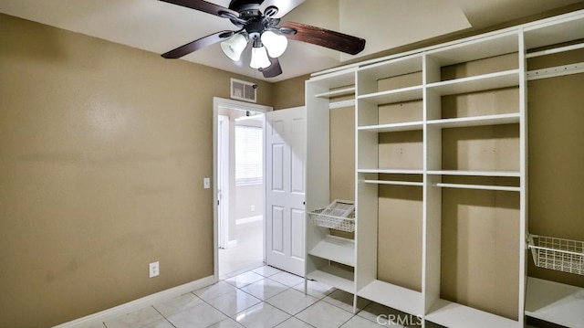 interior space featuring ceiling fan and light tile patterned flooring