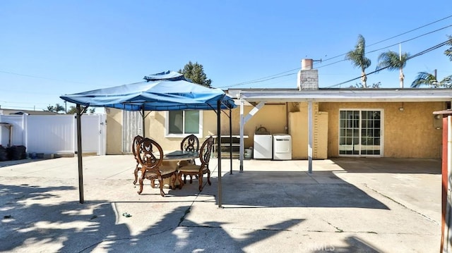 view of patio / terrace featuring washer and clothes dryer