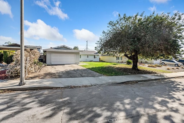 ranch-style home with a front yard and a garage