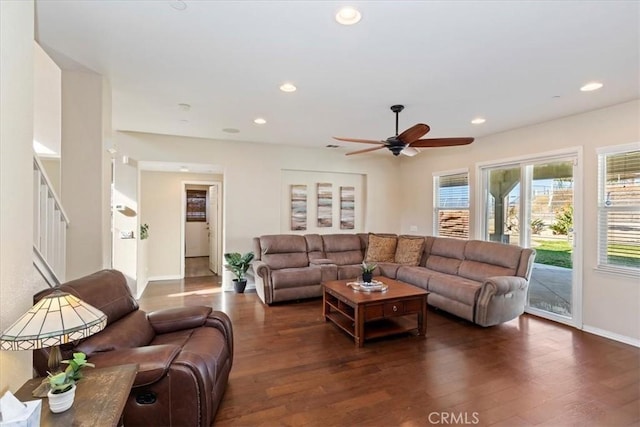 living room with dark hardwood / wood-style floors and ceiling fan