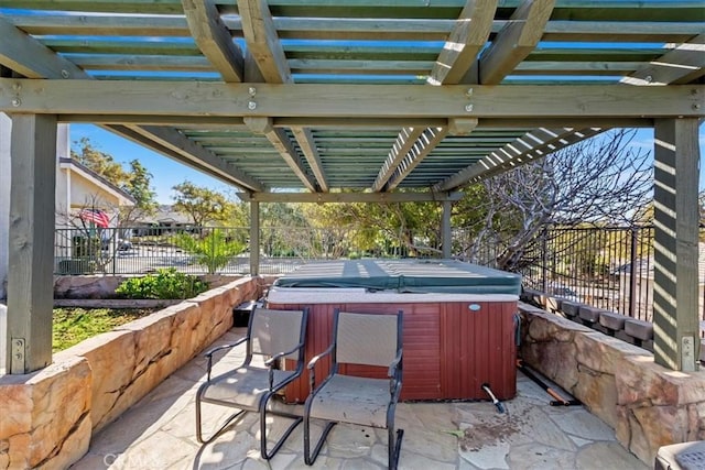 view of patio / terrace with a pergola and a hot tub