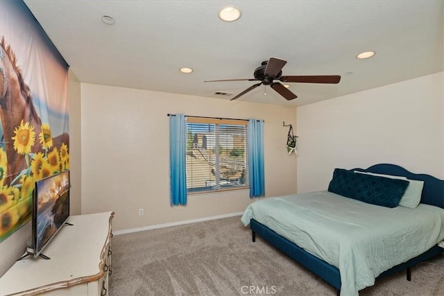 bedroom featuring light carpet and ceiling fan