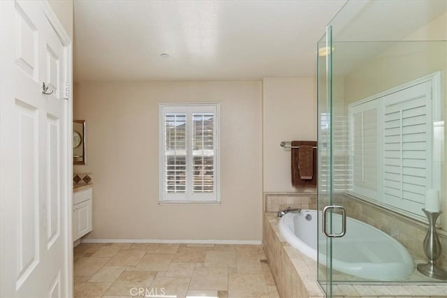 bathroom with plus walk in shower and vanity