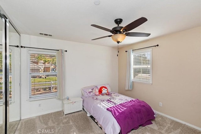 carpeted bedroom with ceiling fan