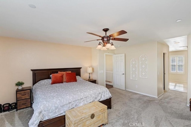 bedroom with light colored carpet and ceiling fan