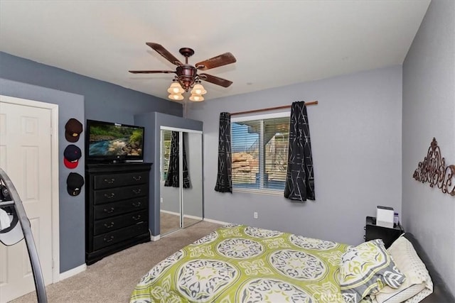 bedroom with ceiling fan and light carpet