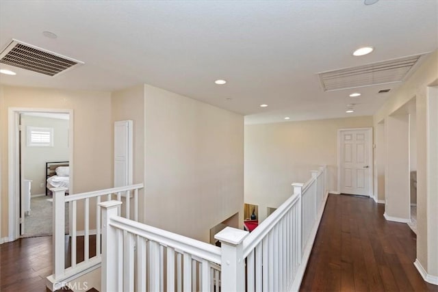 corridor featuring dark hardwood / wood-style flooring