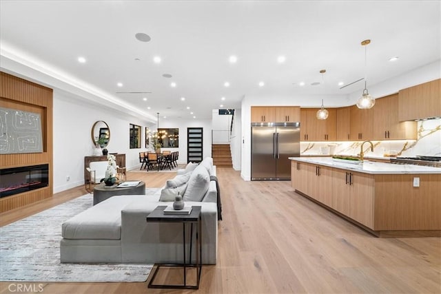 living room with light hardwood / wood-style flooring