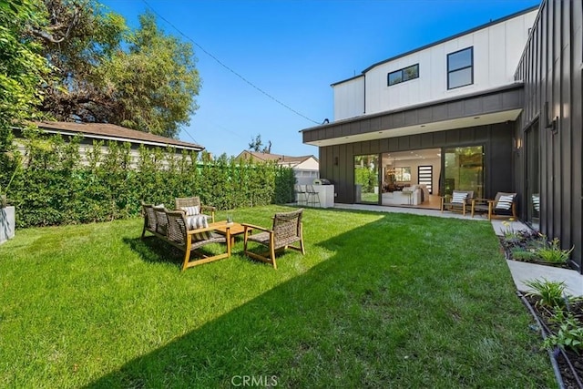 view of yard featuring an outdoor living space and a patio