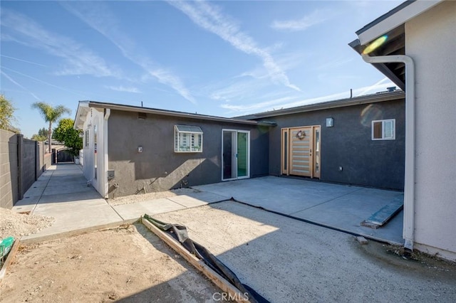 rear view of property featuring a patio