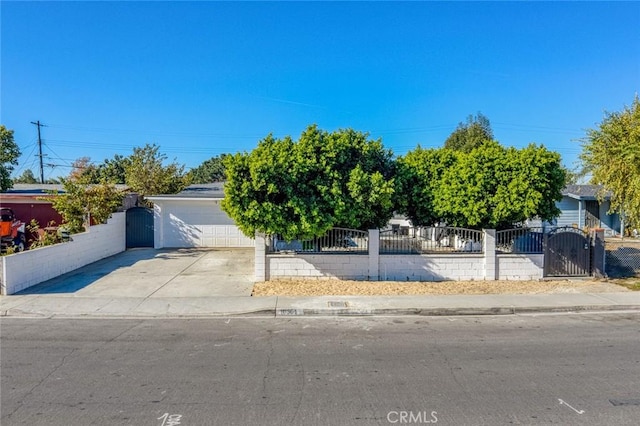 obstructed view of property with a garage