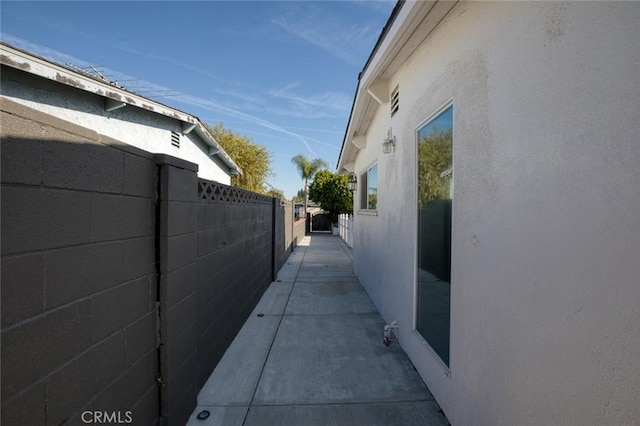 view of side of property with a patio area