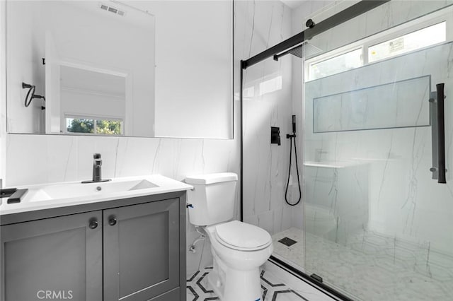 bathroom with tasteful backsplash, walk in shower, vanity, tile walls, and toilet