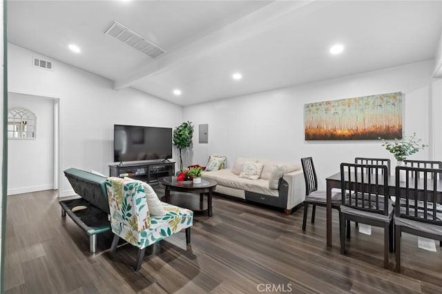 living room featuring lofted ceiling with beams, electric panel, and dark hardwood / wood-style floors