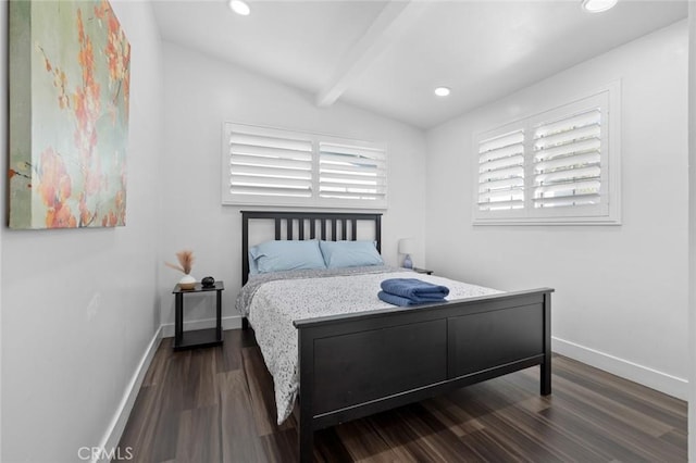 bedroom with vaulted ceiling with beams, dark wood-type flooring, and multiple windows