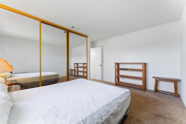 carpeted bedroom featuring a closet