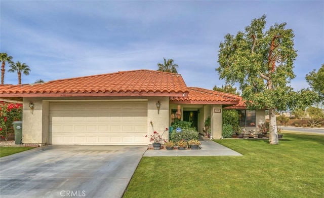 mediterranean / spanish-style home featuring a garage and a front yard