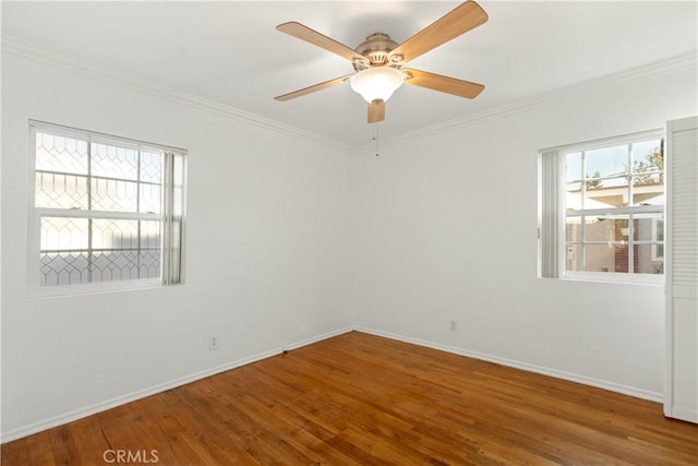 spare room with ceiling fan, hardwood / wood-style floors, and ornamental molding