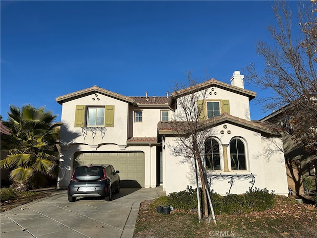 mediterranean / spanish-style house featuring a garage