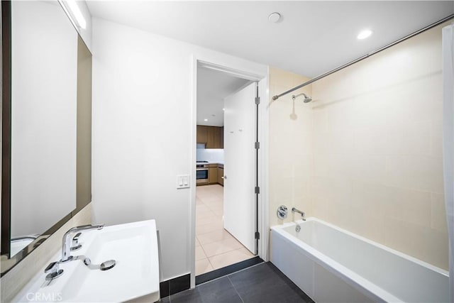 bathroom with tile patterned floors and shower / bath combination