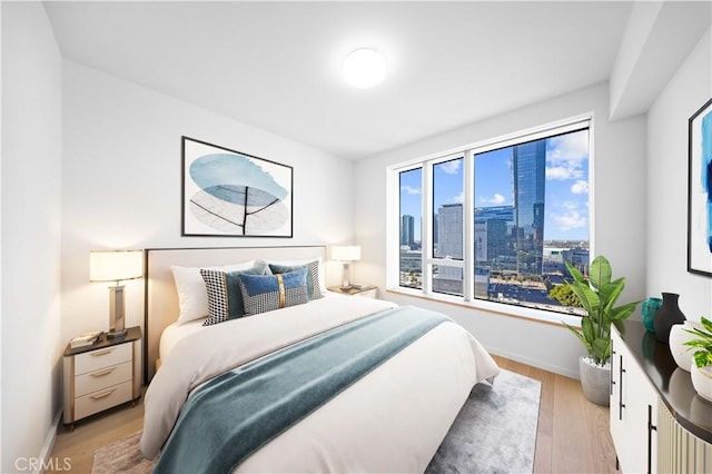 bedroom with light wood-type flooring