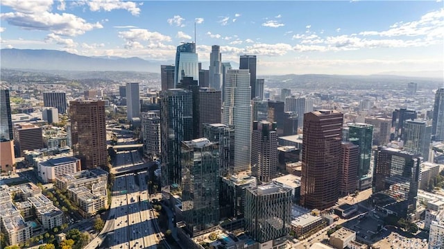 property's view of city with a mountain view