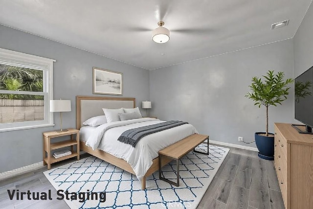 bedroom featuring dark hardwood / wood-style flooring