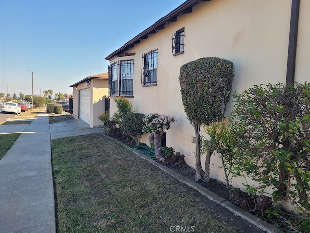 view of side of home featuring a garage