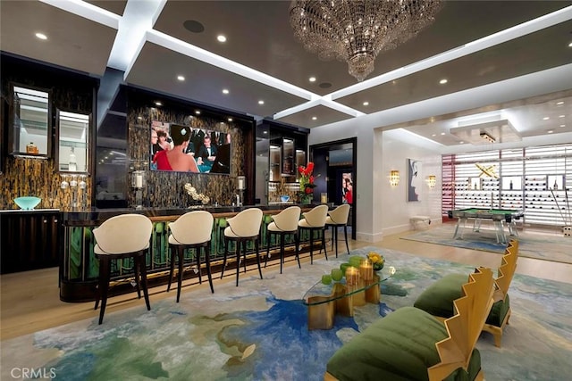 interior space featuring a chandelier, light wood-type flooring, coffered ceiling, and billiards