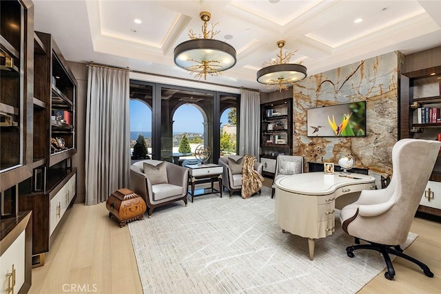 living area featuring light hardwood / wood-style floors and coffered ceiling