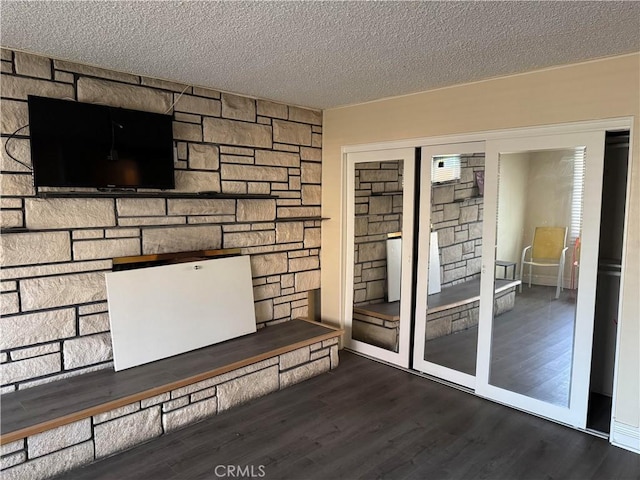 interior space with hardwood / wood-style floors and a textured ceiling