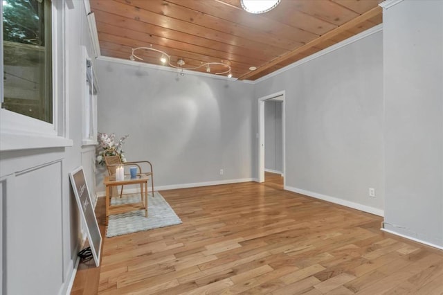 interior space featuring wooden ceiling, crown molding, and light hardwood / wood-style flooring