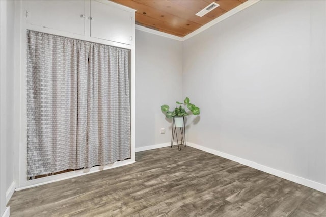 interior space with wood-type flooring, crown molding, and wood ceiling