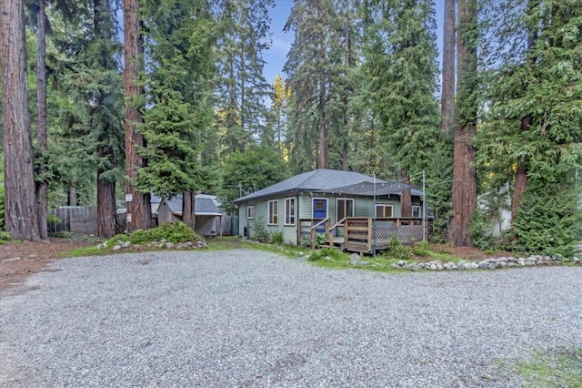 bungalow-style house with a deck