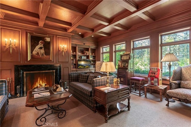 living area featuring wooden ceiling, coffered ceiling, crown molding, wood walls, and carpet floors